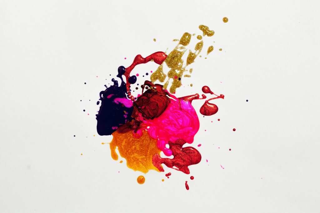 pexels-photo-1193743-1193743 Colorful abstract paint splash on white background, capturing creative expression.
